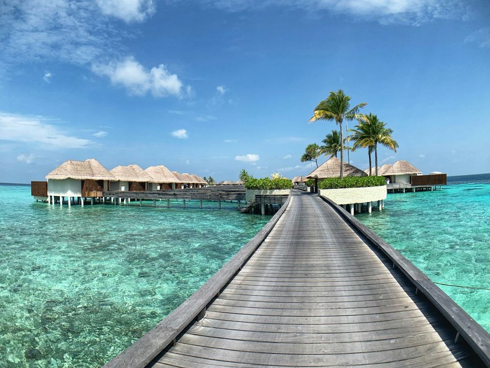 Jetty leading to overwater villas in the Maldives